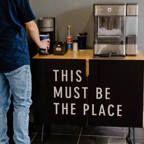 The studio coffee bar, lettered &ldquo;This must be the place&rdquo;