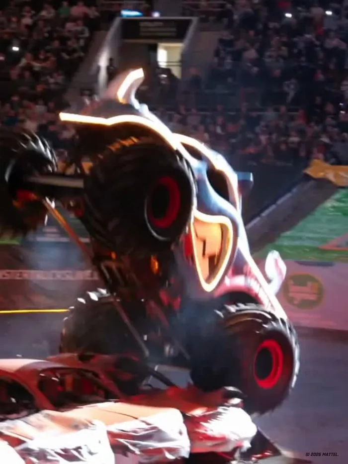 A close-up of a Hot Wheels Monster Trucks Live truck's illuminated character grille