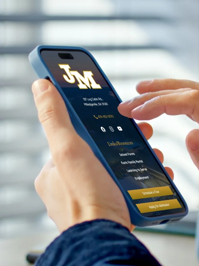 The John Milledge Academy site open on a phone