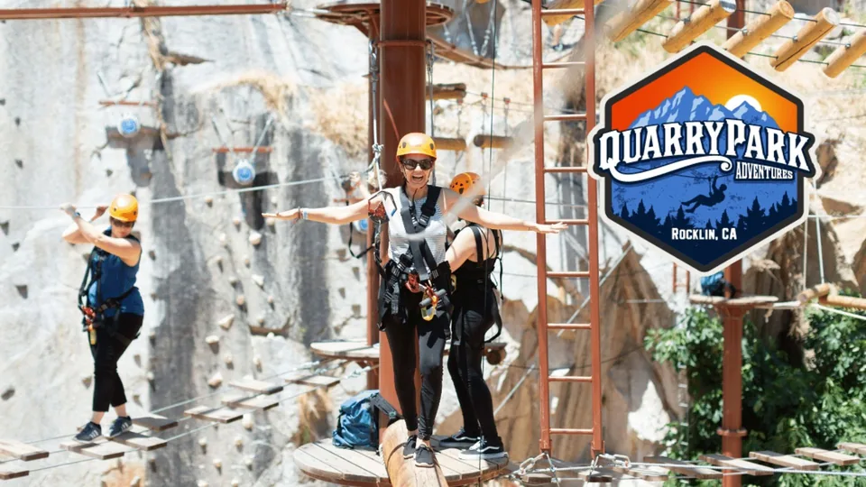 Climbers on a Quarry Park Adventures ropes course beside the park's logo
