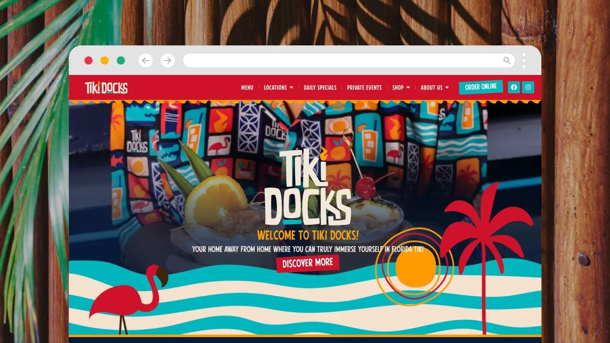 The Tiki Docks Bar & Grill homepage with tropical illustration and a Discover More call to action