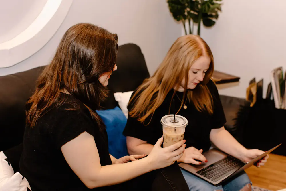 Goebel Media team members collaborating on a laptop